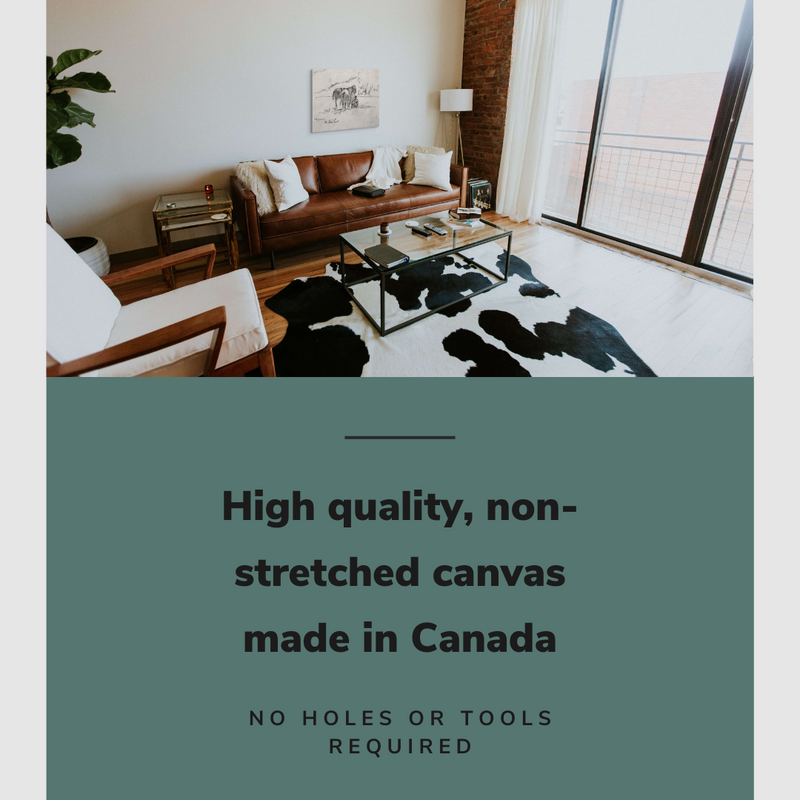 Lifestyle image of the horizontal, 20x30” inch easy to hang canvas wall art hung in a western living room above a couch with graphic saying "High quality, non-stretched canvas made in Canada"