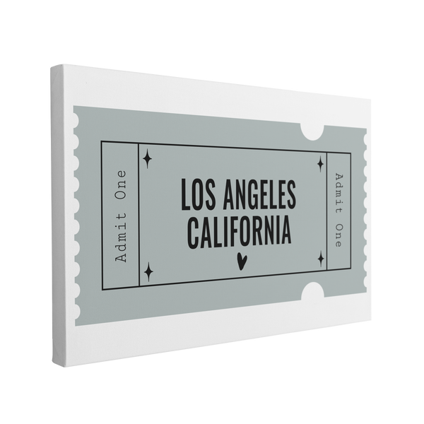 Single, 2:3 horizontal easy to hang canvas print on a transparent background featuring an image of a blue graphic of an Admit One Ticket with black font saying, "Los Angeles, California"