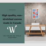 Lifestyle image of the vertical, 20x30” inch easy to hang canvas wall art hung in a bathroom over the sink with graphic saying "High quality, non-stretched canvas made in Canada"