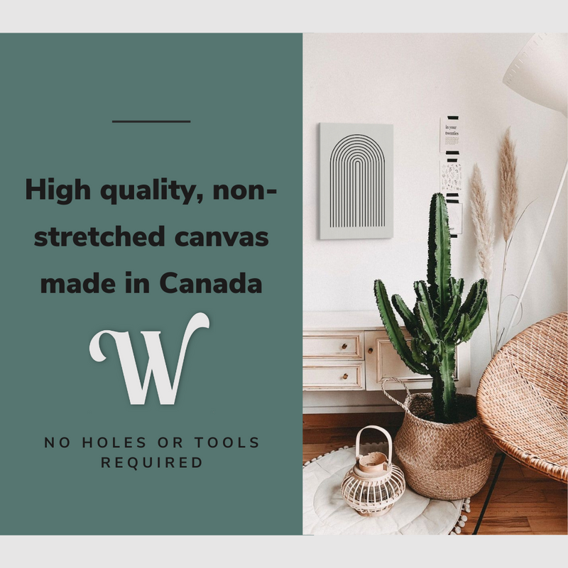 Lifestyle image of the vertical, 20x30 inch easy to hang canvas wall art hung in a bedroom beside a cactus and accent chair with graphic saying "High quality, non-stretched canvas made in Canada"