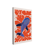 Single, 2:3 vertical easy to hang canvas print on a transparent background featuring an image of blue whales swimming diagonally across the canvas amongst bright orange coral on a white background