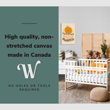 Lifestyle image of the vertical, 20x30” inch easy to hang canvas wall art hung in an autumn themed nursery hung above the crib with graphic saying "High quality, non-stretched canvas made in Canada"