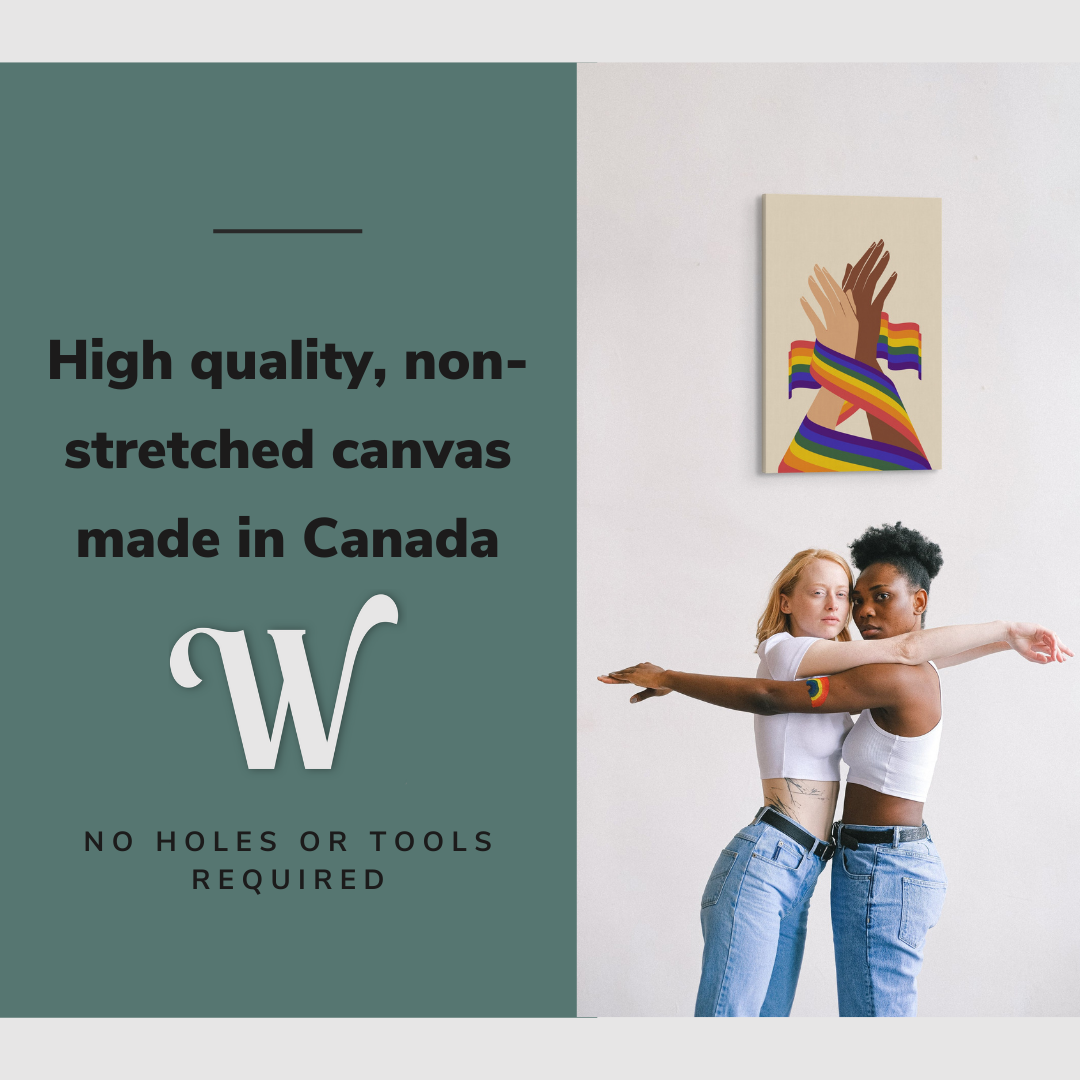 Lifestyle image of the vertical, 20x30 inch easy to hang canvas wall art hung in hung on a plain wall over a lesbian, biracial couple with graphic saying "High quality, non-stretched canvas made in Canada"