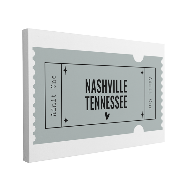 Single, 2:3 horizontal easy to hang canvas print on a transparent background featuring an image of a blue graphic of an Admit One ticket with black words "Nashville, Tennessee"