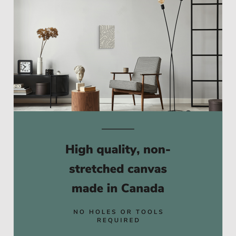 Lifestyle image of the vertical, 12x18 inch easy to hang canvas wall art hung in a living room above an accent chair and a coffee table with graphic saying "High quality, non-stretched canvas made in Canada"