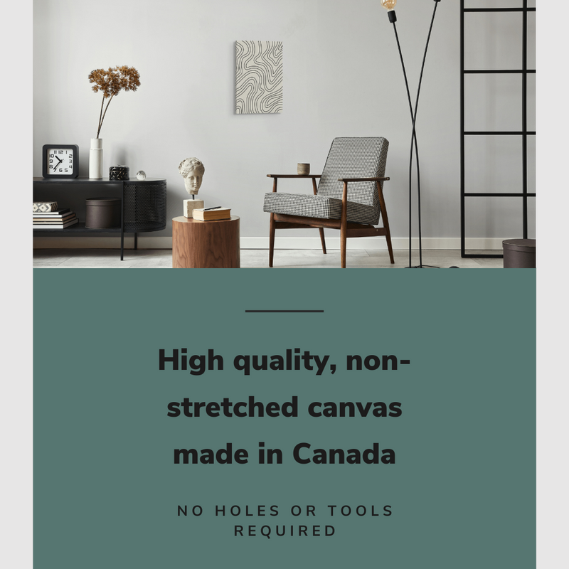 Lifestyle image of the vertical, 16x24 inch easy to hang canvas wall art hung in a living room above an accent chair and a coffee table with graphic saying "High quality, non-stretched canvas made in Canada"