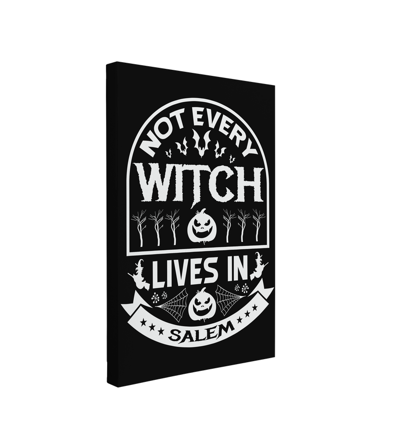 Single, 2:3 vertical easy to hang canvas print on a transparent background featuring an image of white font saying "Not Every Witch Lives in Salem" with bats, trees, jack-o-lanterns, witches and cobwebs surrounding the words on a black background. 