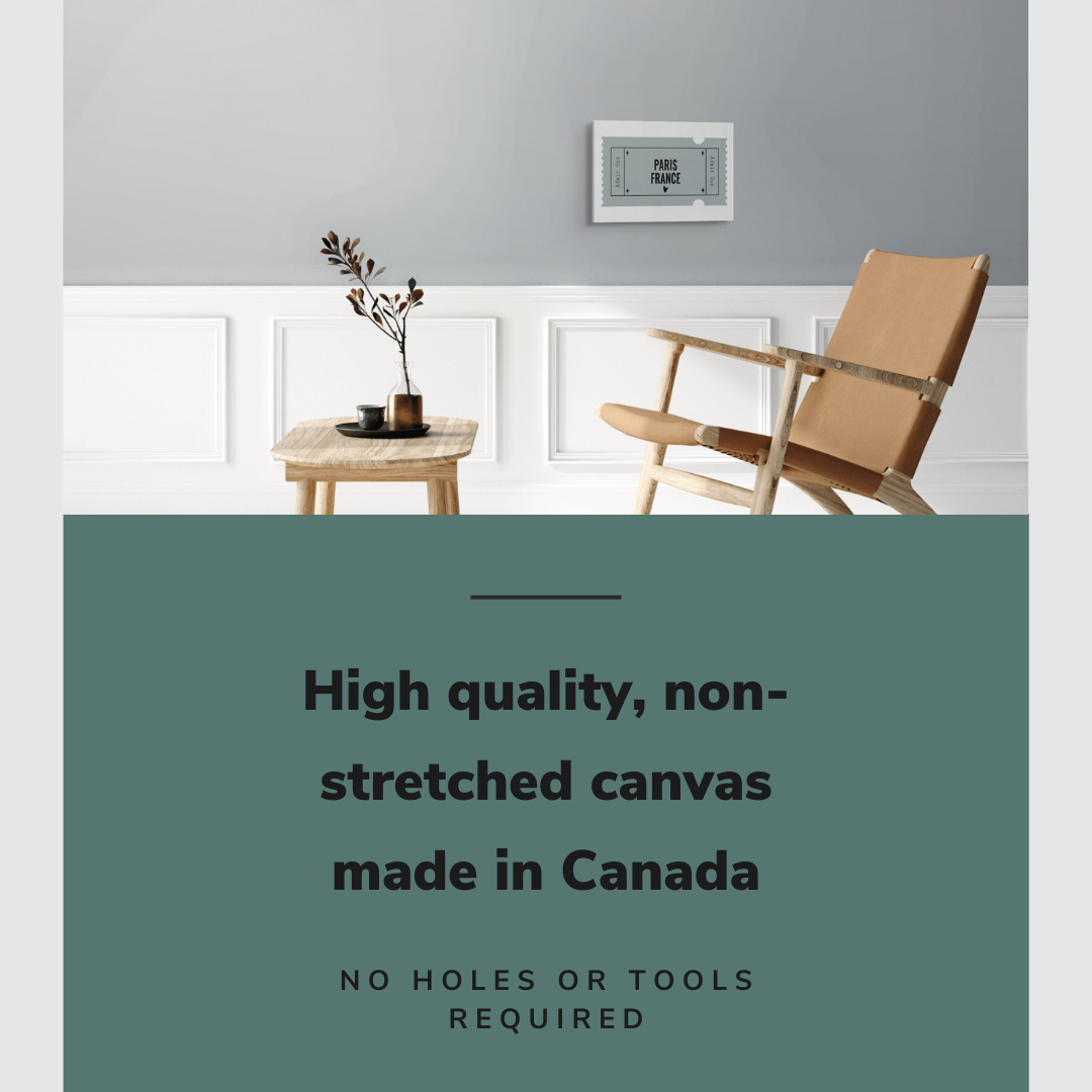 Lifestyle image of the horizontal 12x18” inch easy to hang canvas wall art hung in a living room above a chair and table with graphic saying "High quality, non-stretched canvas made in Canada."