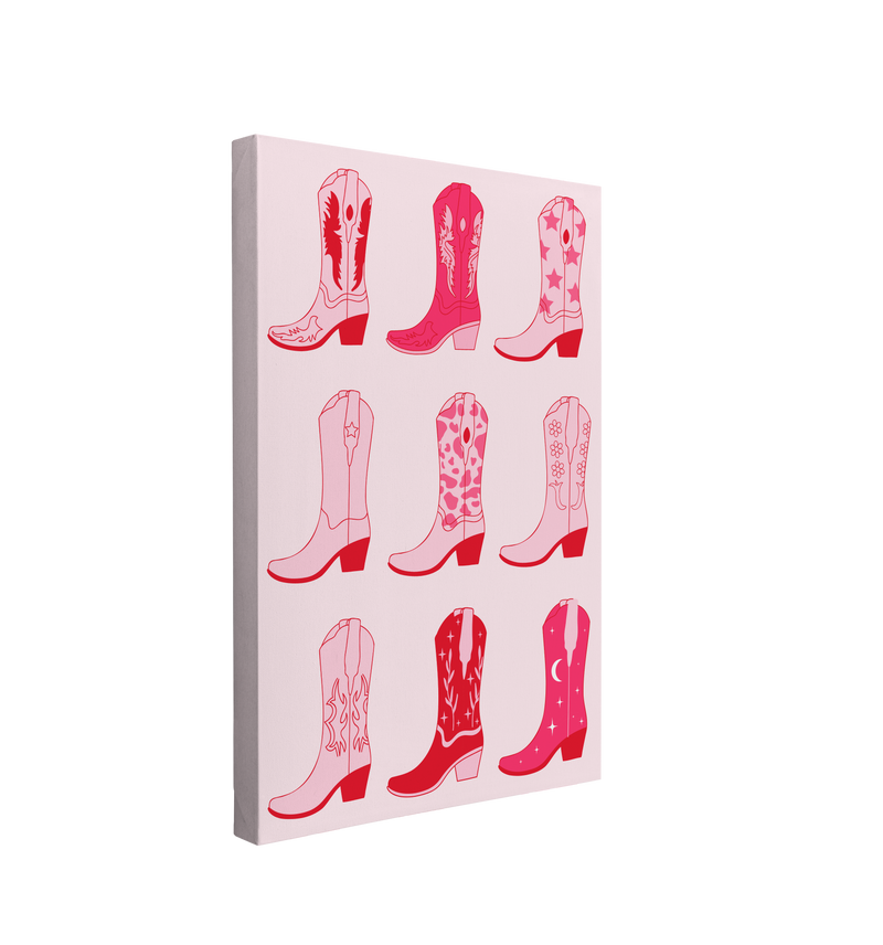 Single, 2:3 vertical easy to hang canvas print on a transparent background featuring an image of nine different pink cowboy boots on a light pink background.