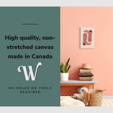 Lifestyle image of the vertical 16x24” inch easy to hang canvas wall art hung in a foyer above a bench with graphic saying "High quality, non-stretched canvas made in Canada."