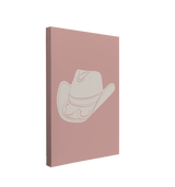 Single, 2:3 vertical easy to hang canvas print on a transparent background featuring an image of cowboy hat in white on a pink backgound.