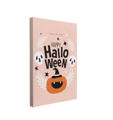 Single, 2:3 vertical easy to hang canvas print on a transparent background featuring an image of a cute jack-o-latern with a witch's hat with the words, "Happy Halloween" above it in black with two black and white skulls beside the words. "Trick or Treat" is above everything and it is all on a light pastel pink background. 