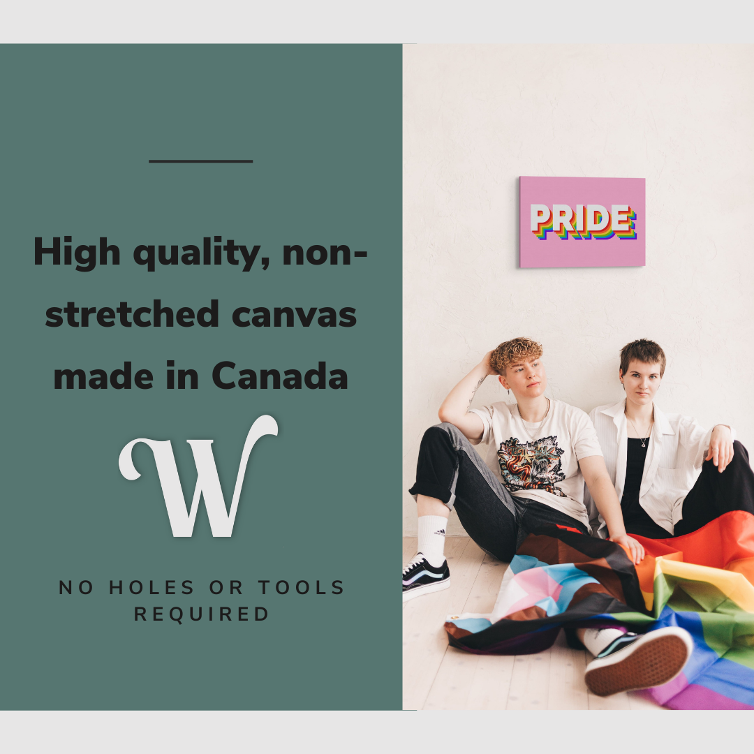 Lifestyle image of the vertical, 16x24 inch easy to hang canvas wall art hung in on a blank wall above a gay couple holding a pride flag with graphic saying "High quality, non-stretched canvas made in Canada"