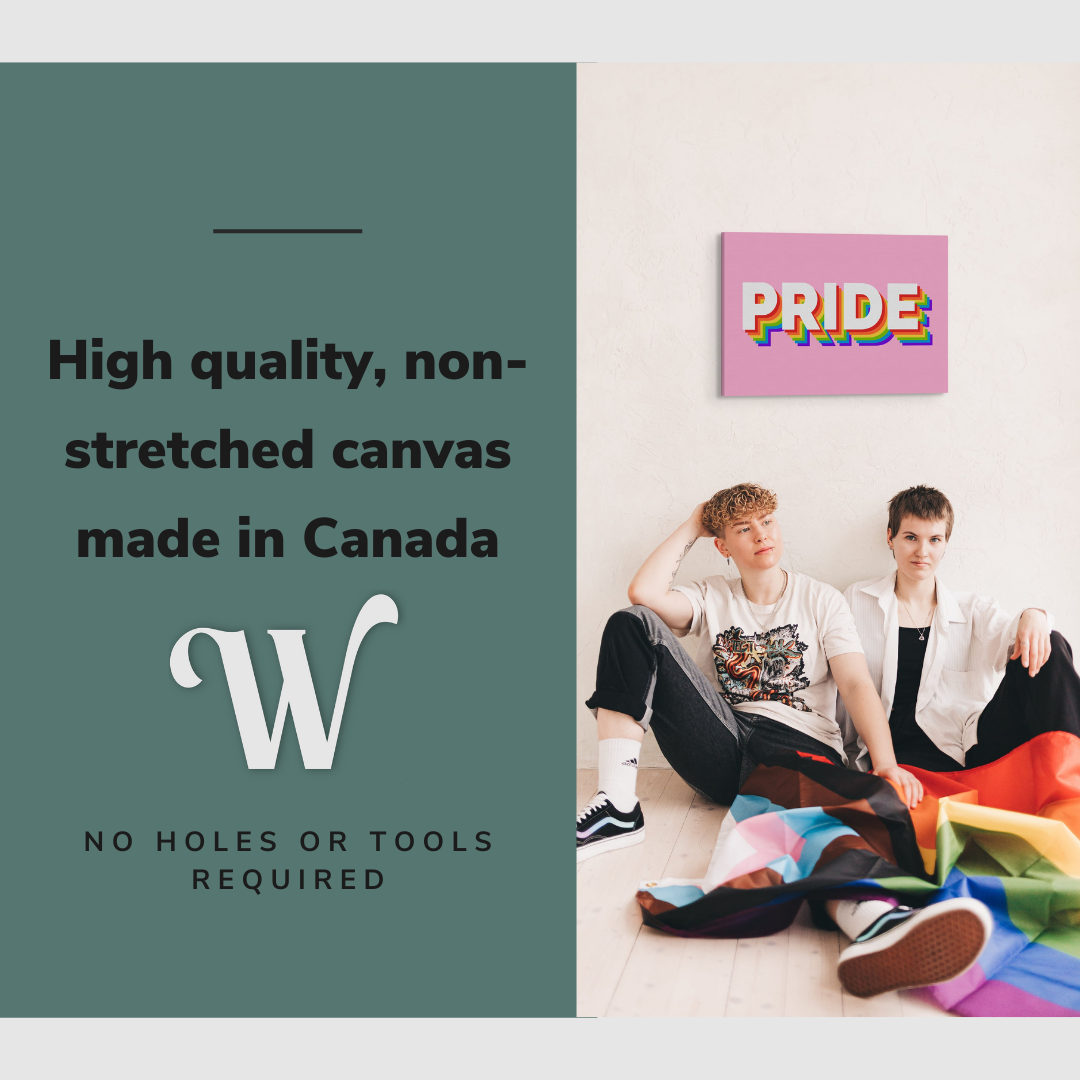 Lifestyle image of the vertical, 20x30 inch easy to hang canvas wall art hung in on a blank wall above a gay couple holding a pride flag with graphic saying "High quality, non-stretched canvas made in Canada"