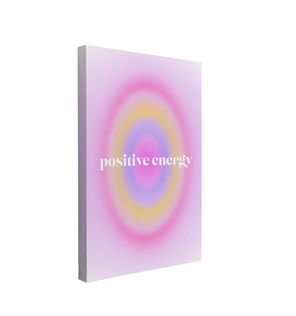 single, 2:3 vertical easy to hang canvas print on a transparent background featuring an image of a large purple gradient oval pulsing in colors purple, yellow, and blue on a light lavender background with white font "positive energy" in the center