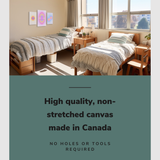 Lifestyle image of the vertical 16x24" and 12x18"s inch set of 3 easy to hang canvas wall art hung in a college dorm above two twin sizes beds with graphic saying "High quality, non-stretched canvas made in Canada"