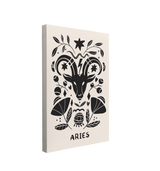 Single, 2:3 vertical easy to hang canvas print on a transparent background featuring an image of black and white interpretation of the Aries zodiac symbol featuring a goat's head and florals in a nordic art style.