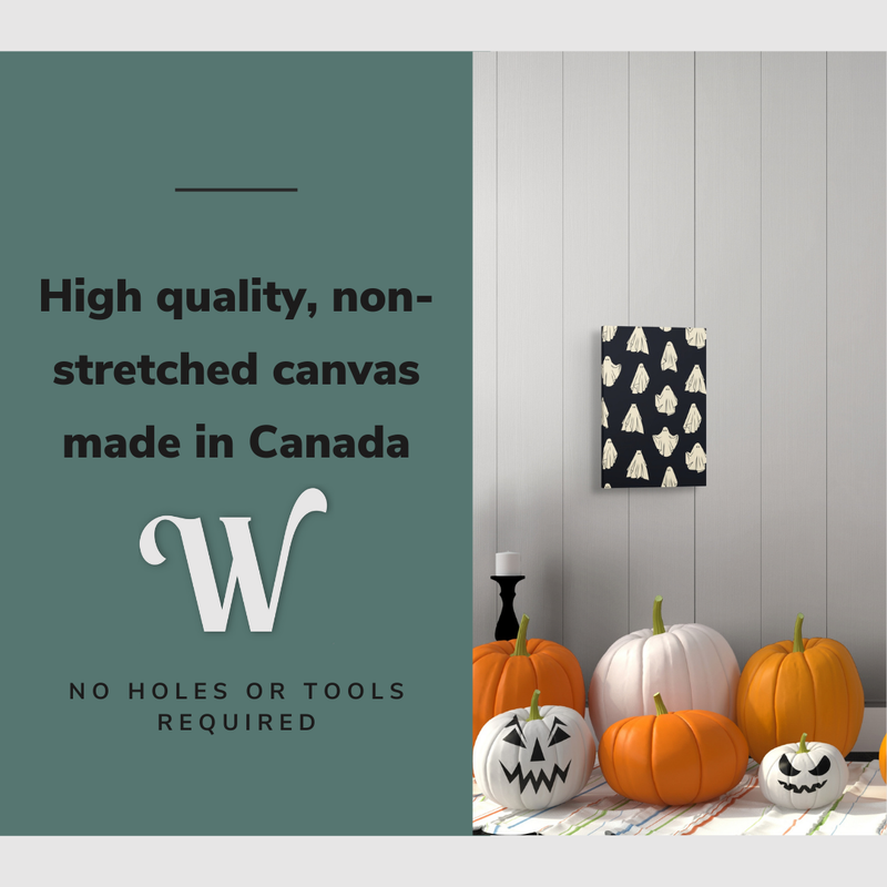 Lifestyle image of the vertical 16x24” inch easy to hang canvas wall art hung in a Halloween decorated foyer above some pumpkins with graphic saying "High quality, non-stretched canvas made in Canada."