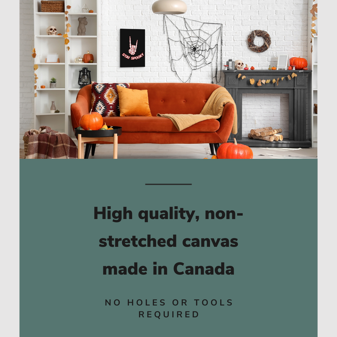 Lifestyle image of the vertical 16x24” inch easy to hang canvas wall art hung in a Halloween decorated living room above a couch and a fireplace with graphic saying "High quality, non-stretched canvas made in Canada."