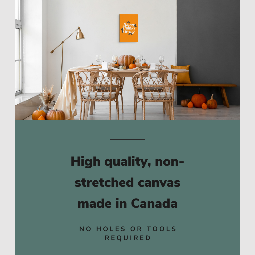 Lifestyle image of the vertical 12x18” inch easy to hang canvas wall art hung in a dining room above the dining table decorated for Thanksgiving with graphic saying "High quality, non-stretched canvas made in Canada."