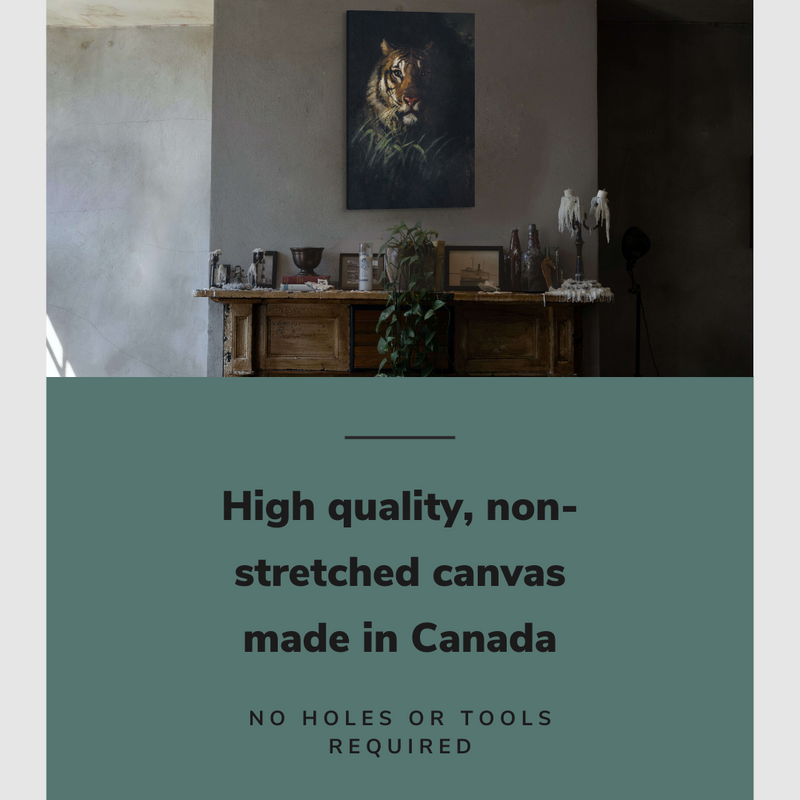 Lifestyle image of the vertical, 20x30 inch easy to hang canvas wall art hung in a living room above a fireplace mantle with plants and frames with graphic saying "High quality, non-stretched canvas made in Canada"