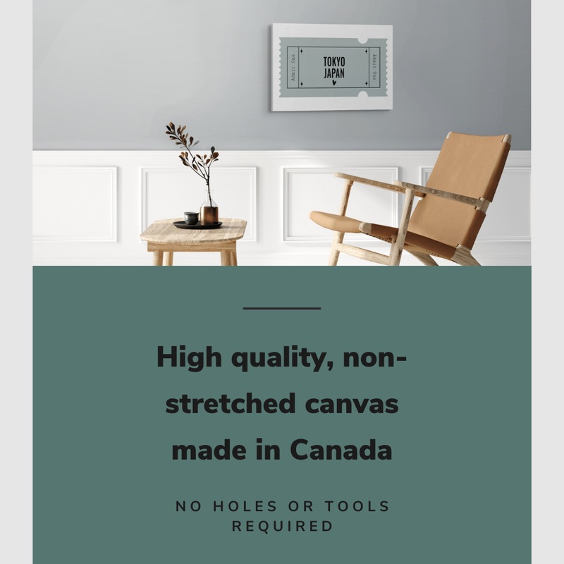 Lifestyle image of the horizontal, 20x30” inch easy to hang canvas wall art hung in a living room above a table and chair with graphic saying "High quality, non-stretched canvas made in Canada"