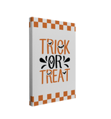 Single, 2:3 vertical easy to hang canvas print on a transparent background featuring an image of the words, "Trick or Treat" in orange and black with bats flying through the font on a white background with a retro border of orange checkers.