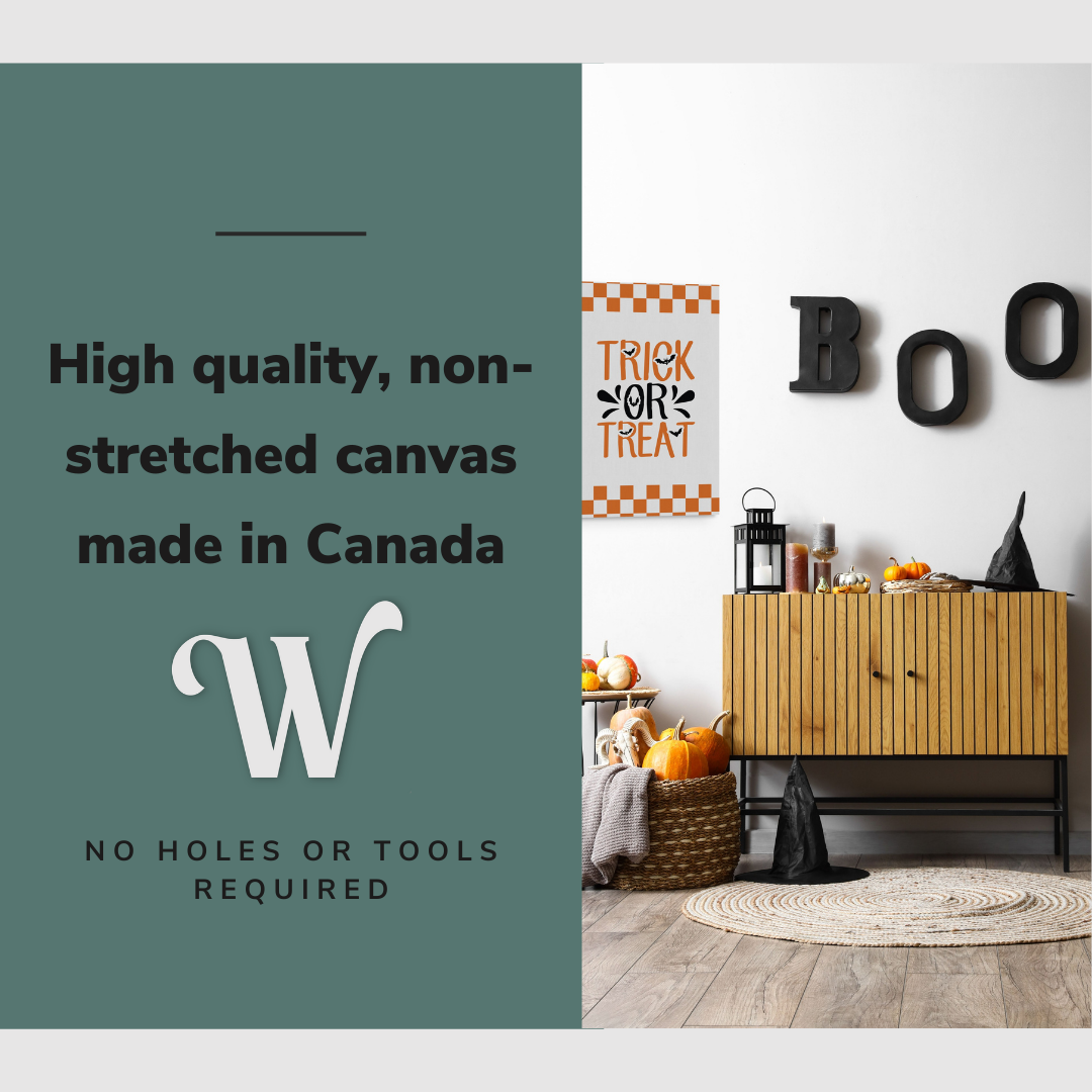 Lifestyle image of the vertical, 20x30” inch easy to hang canvas wall art hung in a Halloween decorated hallway above a credenza with graphic saying "High quality, non-stretched canvas made in Canada"