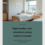 Lifestyle image of the vertical, 12x18 inch easy to hang canvas wall art hung in a dorm bedroom hung above a single bed with graphic saying "High quality, non-stretched canvas made in Canada"