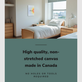 Lifestyle image of the vertical, 16x24 inch easy to hang canvas wall art hung in a dorm bedroom hung above a single bed with graphic saying "High quality, non-stretched canvas made in Canada"